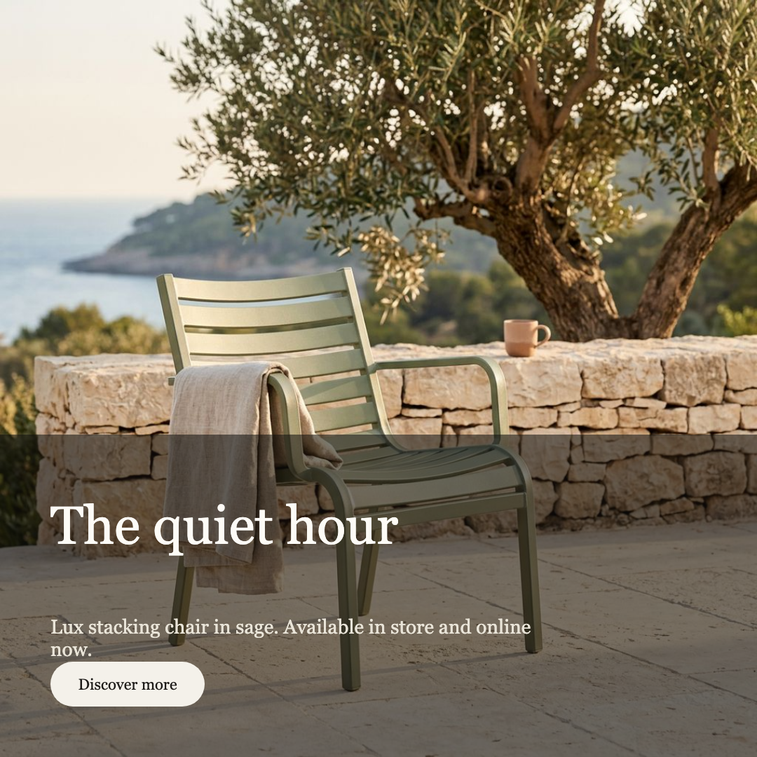 Campaign creative for the Lux stacking chair – Sage: golden-hour terrace scene with the copy composed over it, approved